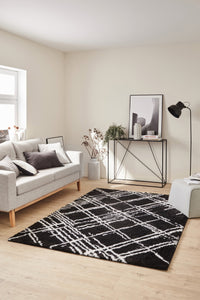 Tapis abstrait noir motif géométrique Nazar rugs