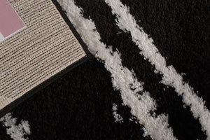Tapis abstrait noir motif géométrique Nazar rugs