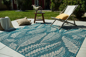 Tapis moderne motif palmier turquoise Nazar rugs